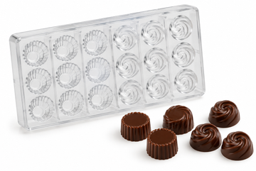 Polycarbonate chocolate mold with 18 cavities, including 9 fluted muffin cup cavities and 9 swirl cavities, with finished chocolates